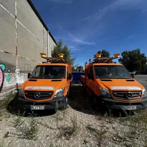Well-maintained vehicles/trucks and benches from a government inventory