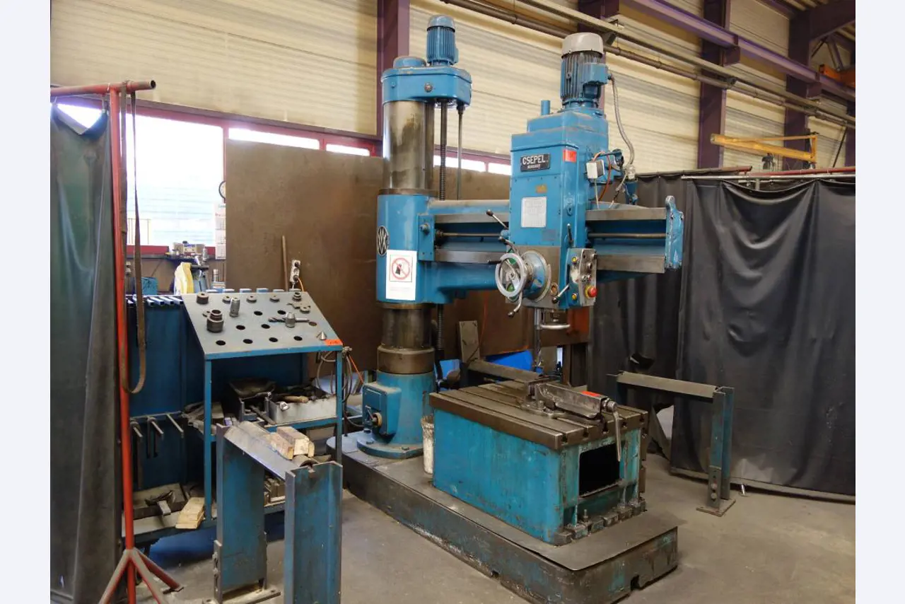 Machines for sheet metal working, business and office equipment as well as vehicle fleet-1