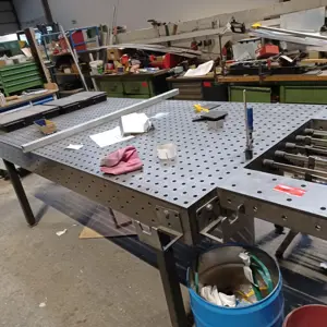 Perforated welding table