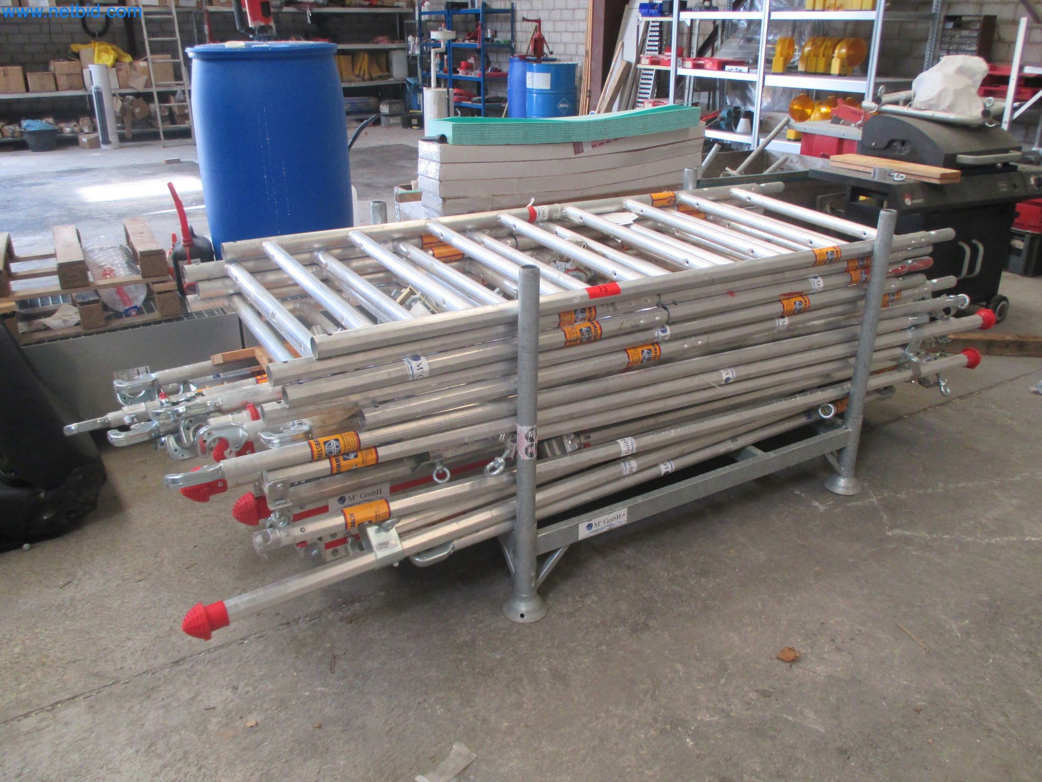 Scaffolding components (some from the construction site), machinery, and vehicles belonging to a construction company-1