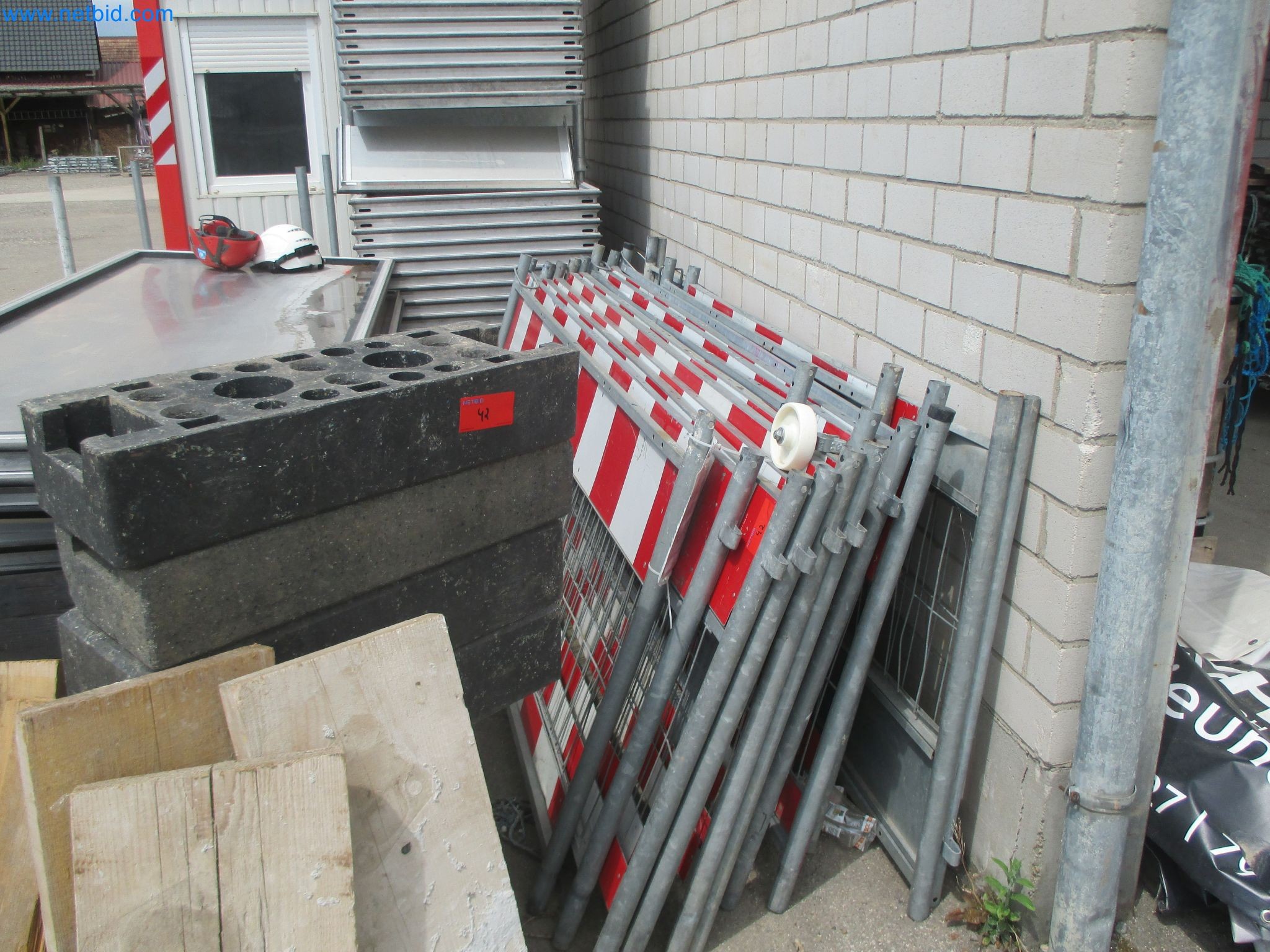 Scaffolding components (some from the construction site), machinery, and vehicles belonging to a construction company-1