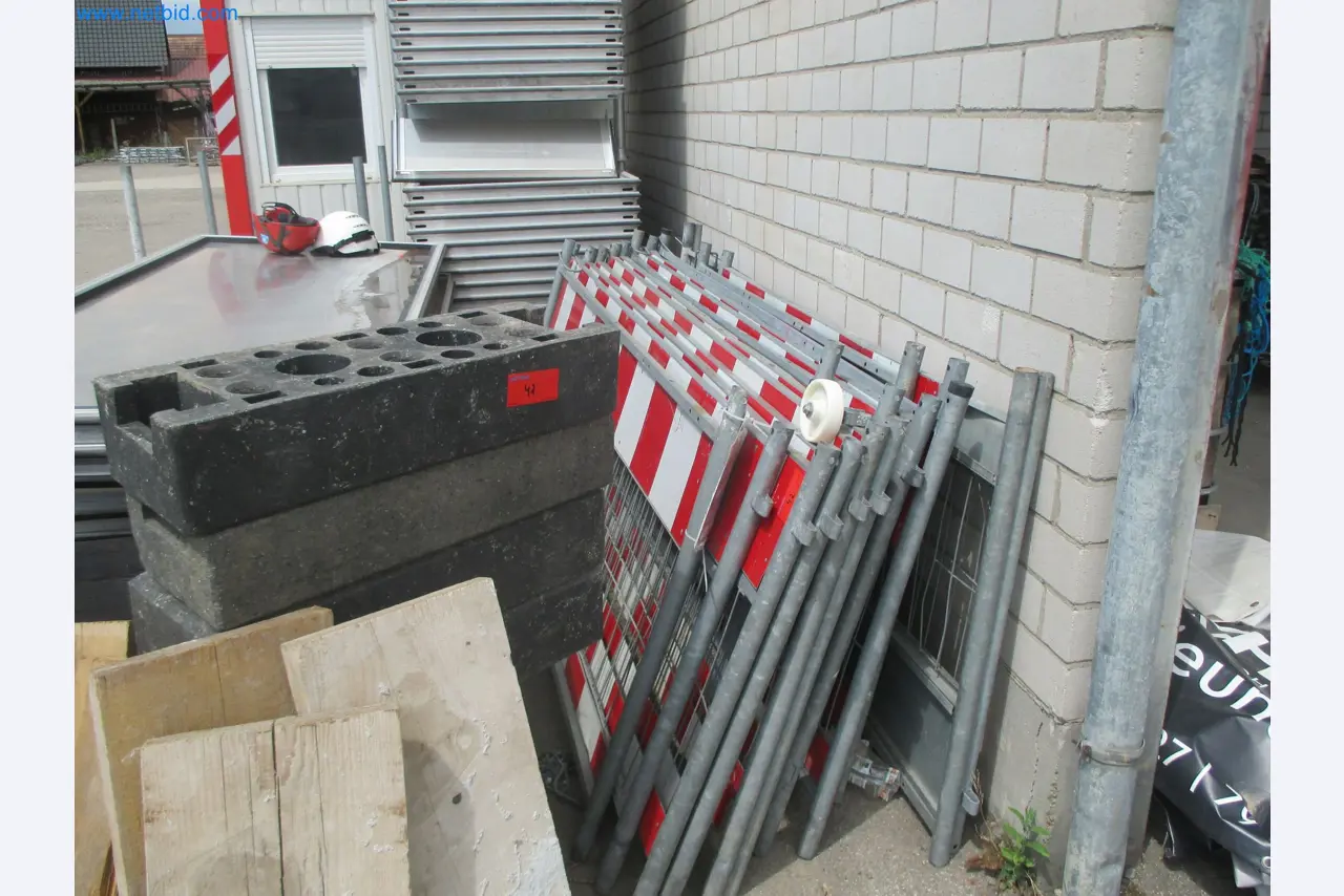 Scaffolding components (some from the construction site), machinery, and vehicles belonging to a construction company-1