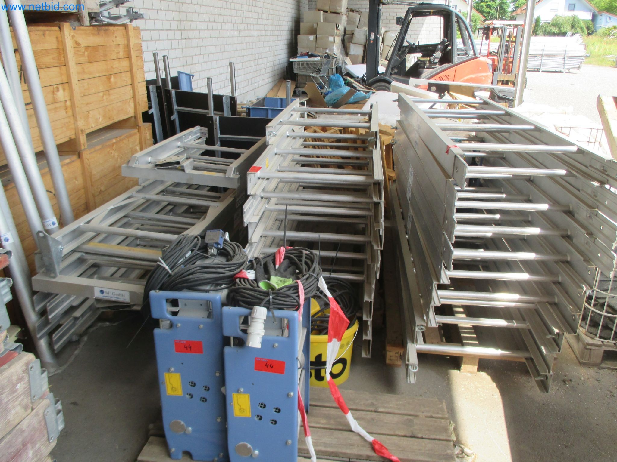 Scaffolding components (some from the construction site), machinery, and vehicles belonging to a construction company-1