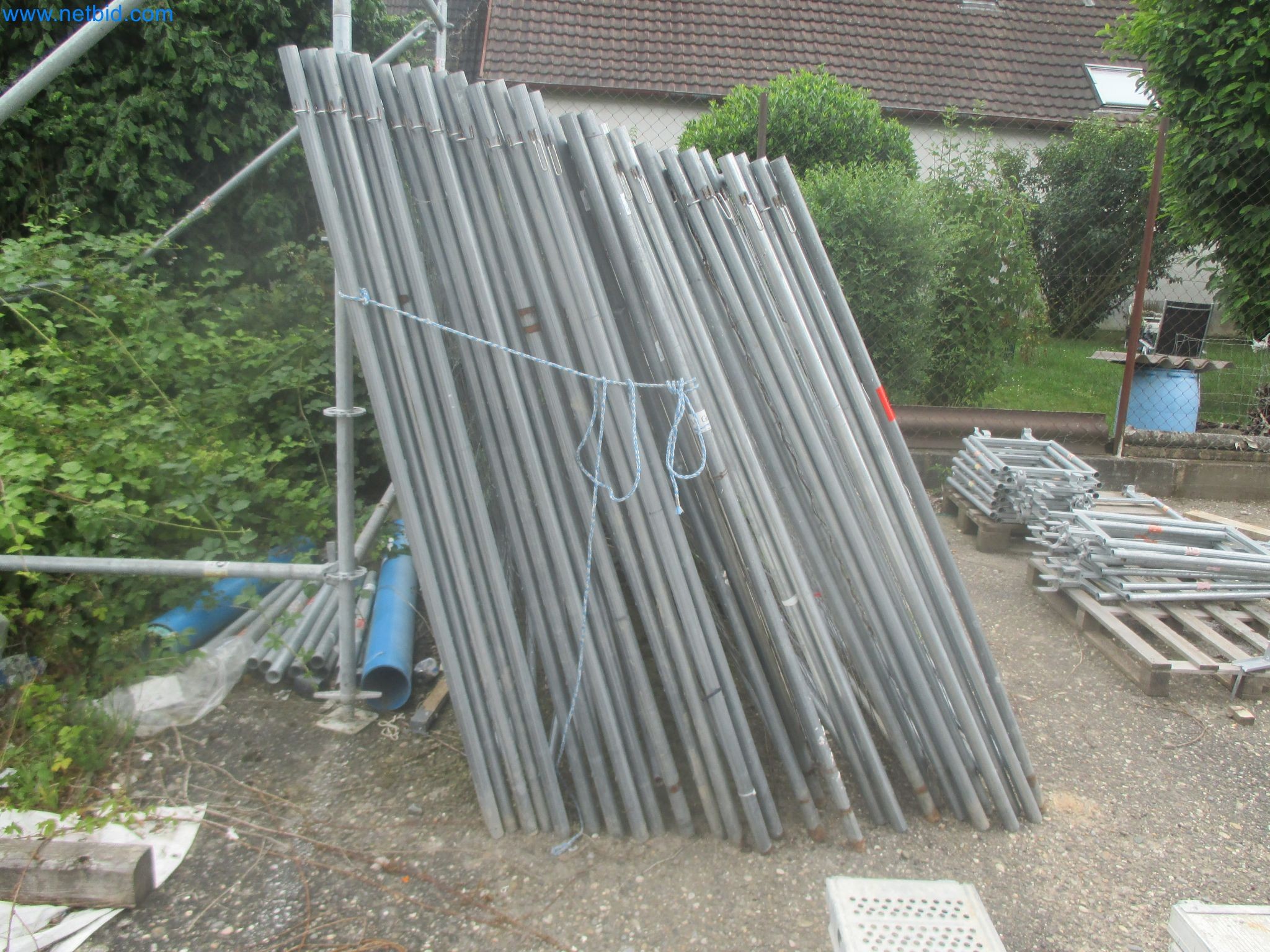 Scaffolding components (some from the construction site), machinery, and vehicles belonging to a construction company-1