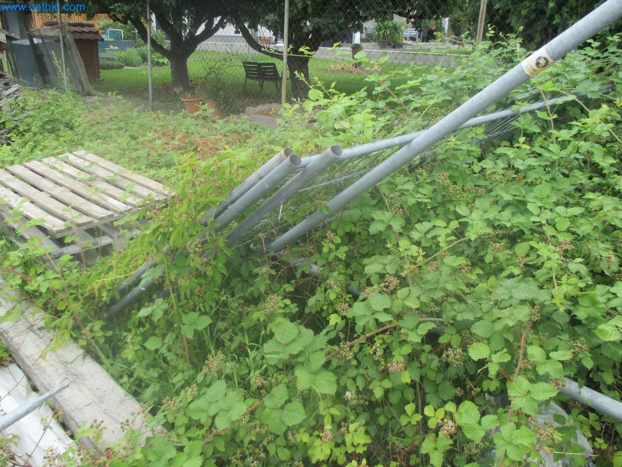 Scaffolding components (some from the construction site), machinery, and vehicles belonging to a construction company-4