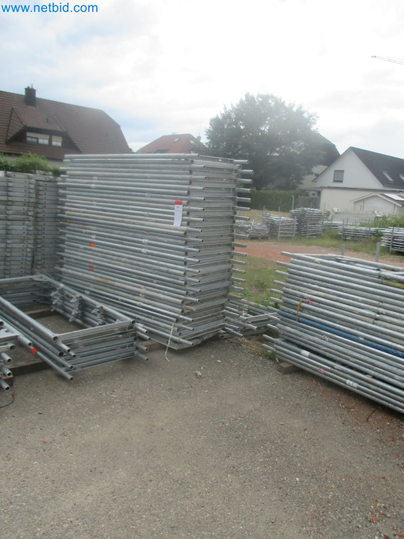 Scaffolding components (some from the construction site), machinery, and vehicles belonging to a construction company-10