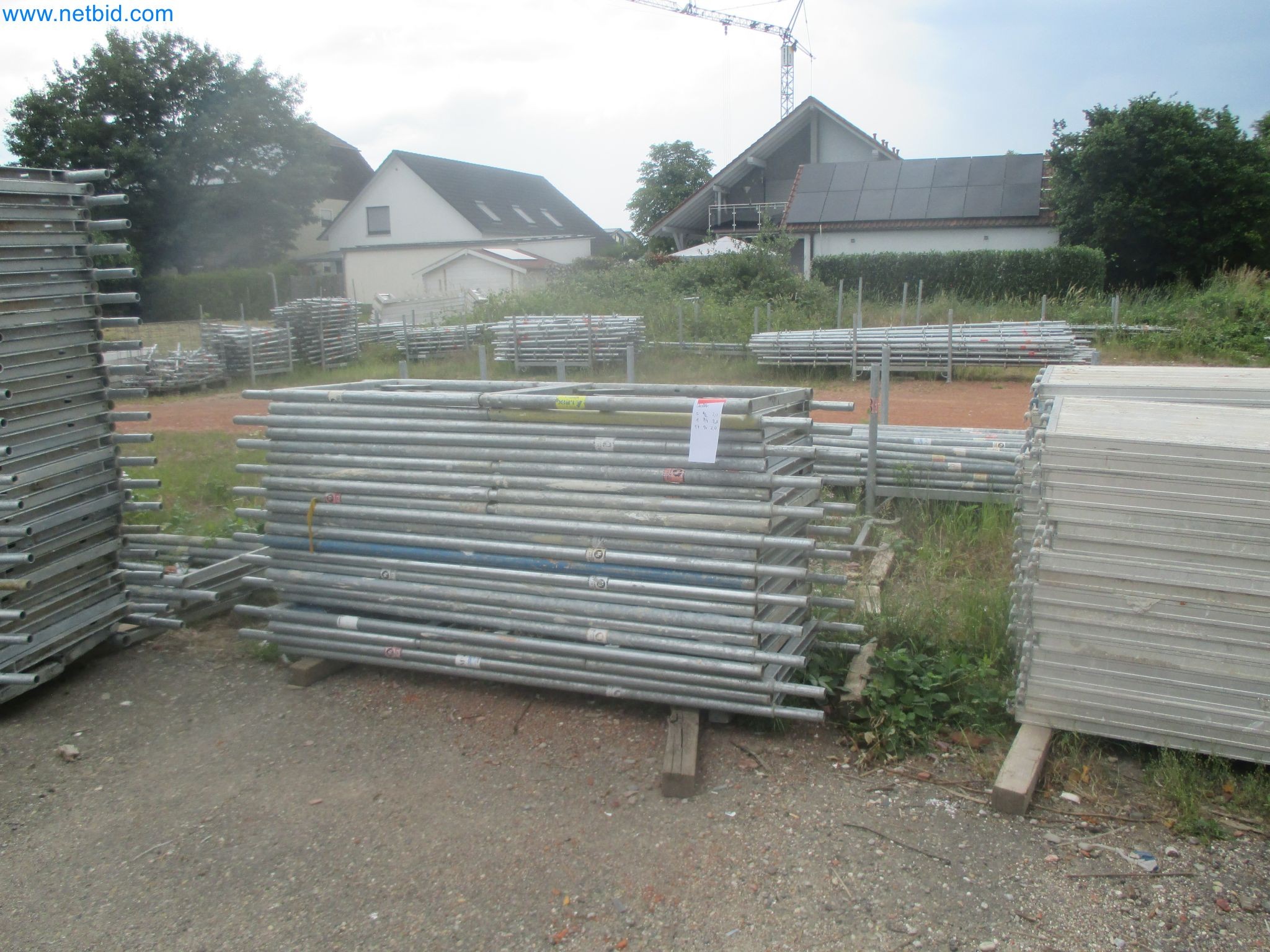 Scaffolding components (some from the construction site), machinery, and vehicles belonging to a construction company-11