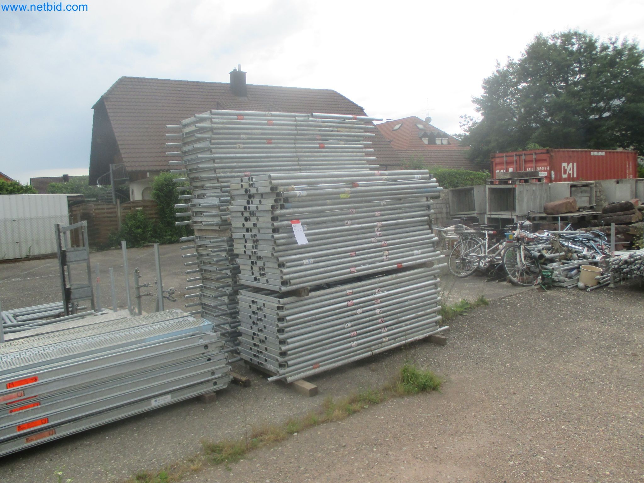 Scaffolding components (some from the construction site), machinery, and vehicles belonging to a construction company-12