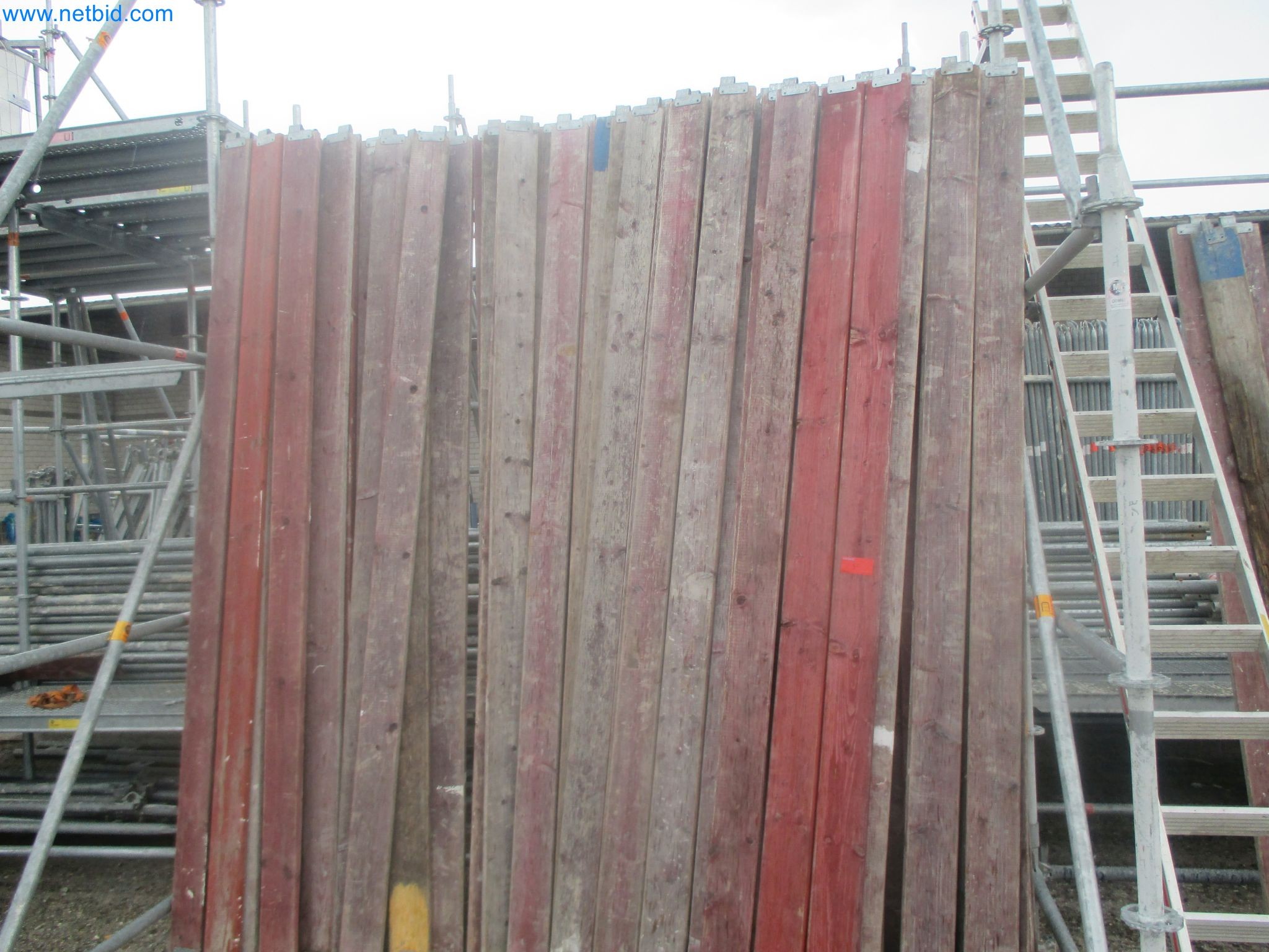 Scaffolding components (some from the construction site), machinery, and vehicles belonging to a construction company-13