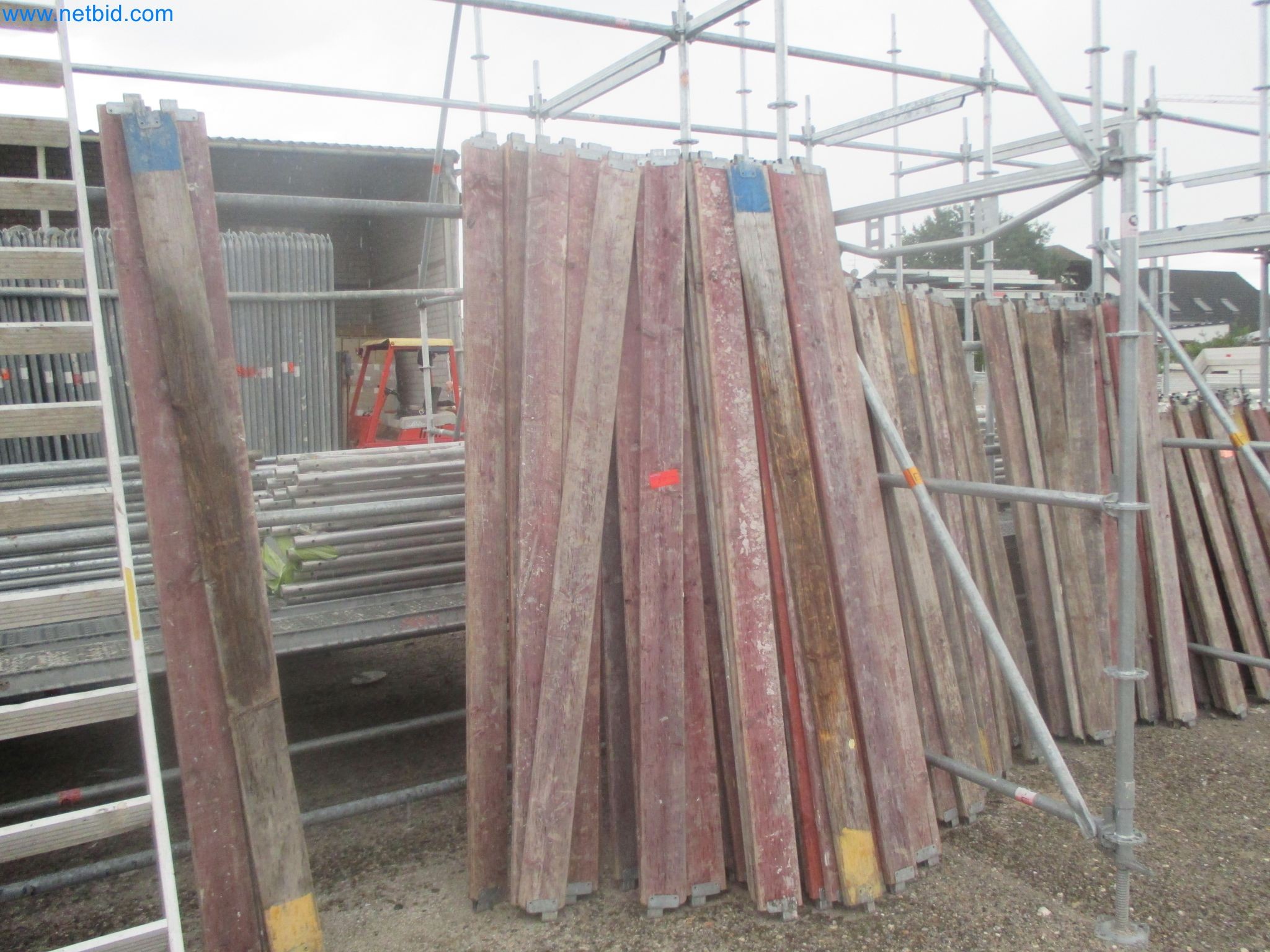 Scaffolding components (some from the construction site), machinery, and vehicles belonging to a construction company-14
