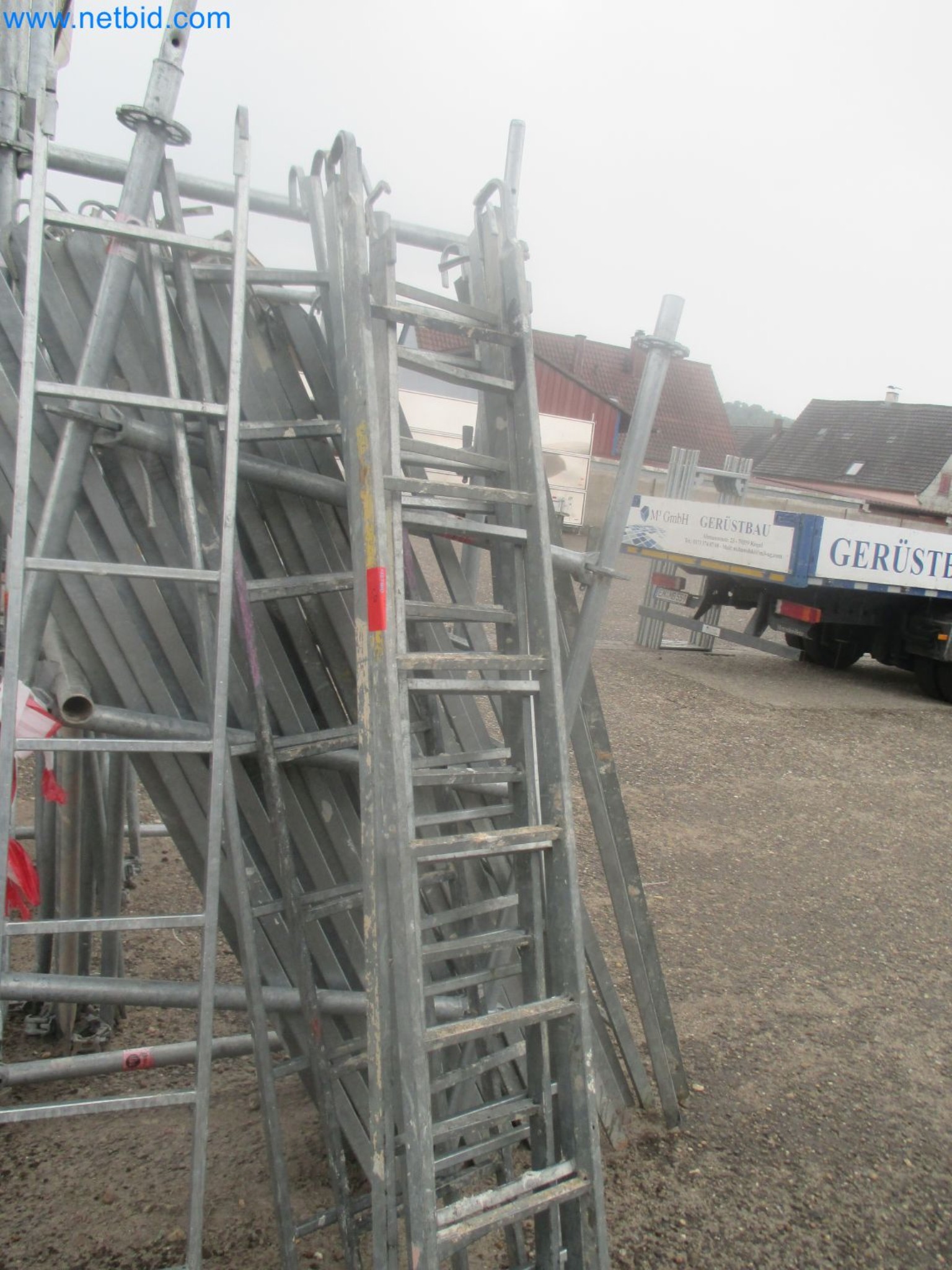 Scaffolding components (some from the construction site), machinery, and vehicles belonging to a construction company-15