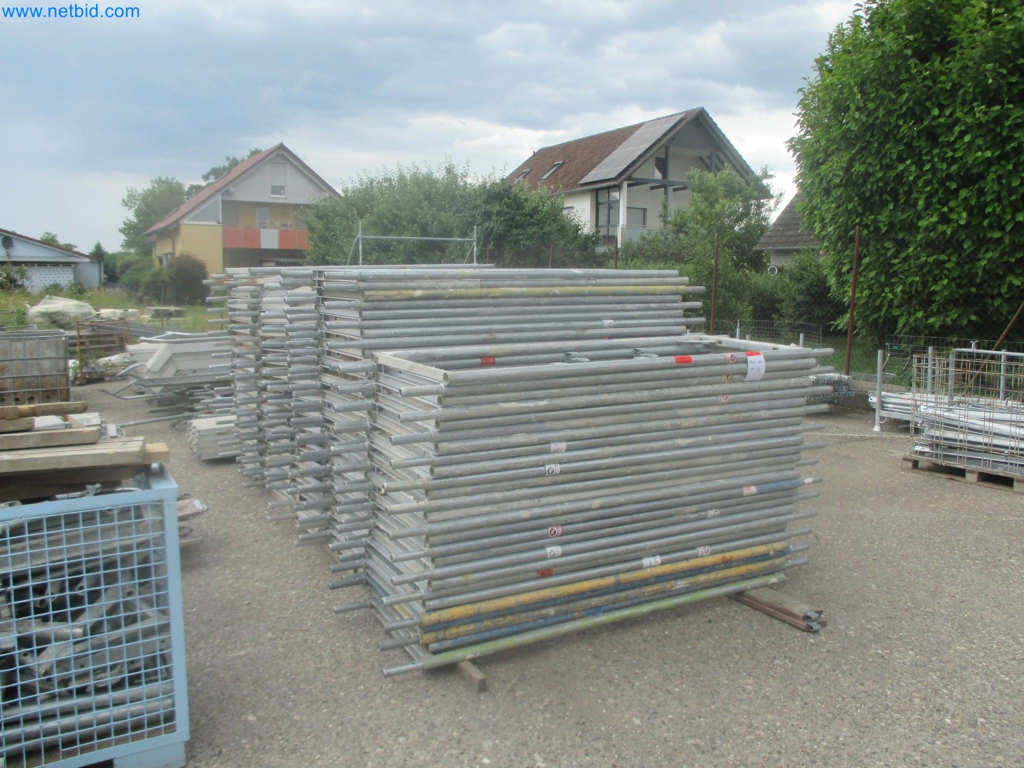 Scaffolding components (some from the construction site), machinery, and vehicles belonging to a construction company-16
