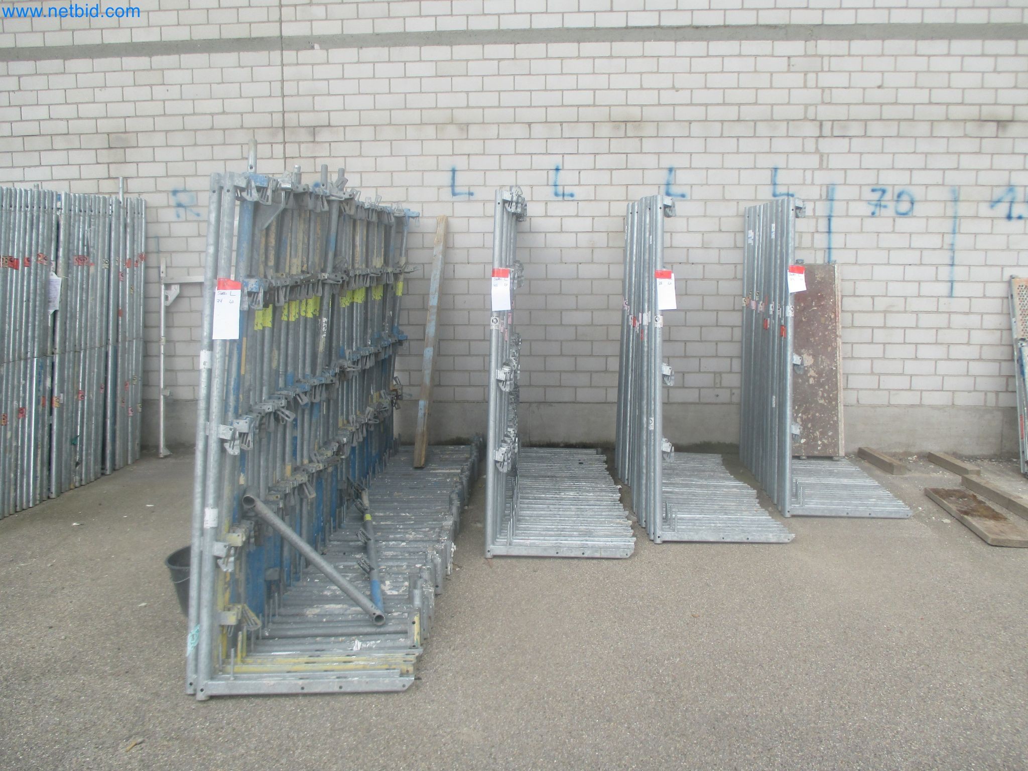 Scaffolding components (some from the construction site), machinery, and vehicles belonging to a construction company-1