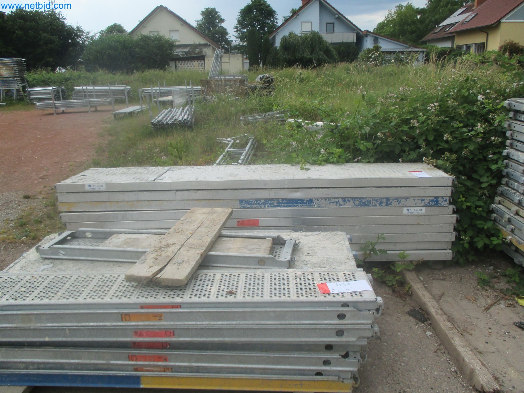 Scaffolding components (some from the construction site), machinery, and vehicles belonging to a construction company-6