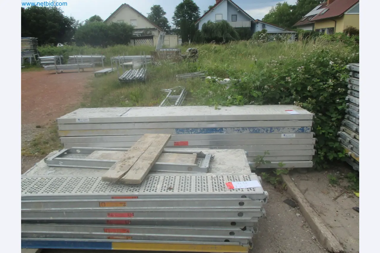 Scaffolding components (some from the construction site), machinery, and vehicles belonging to a construction company-6