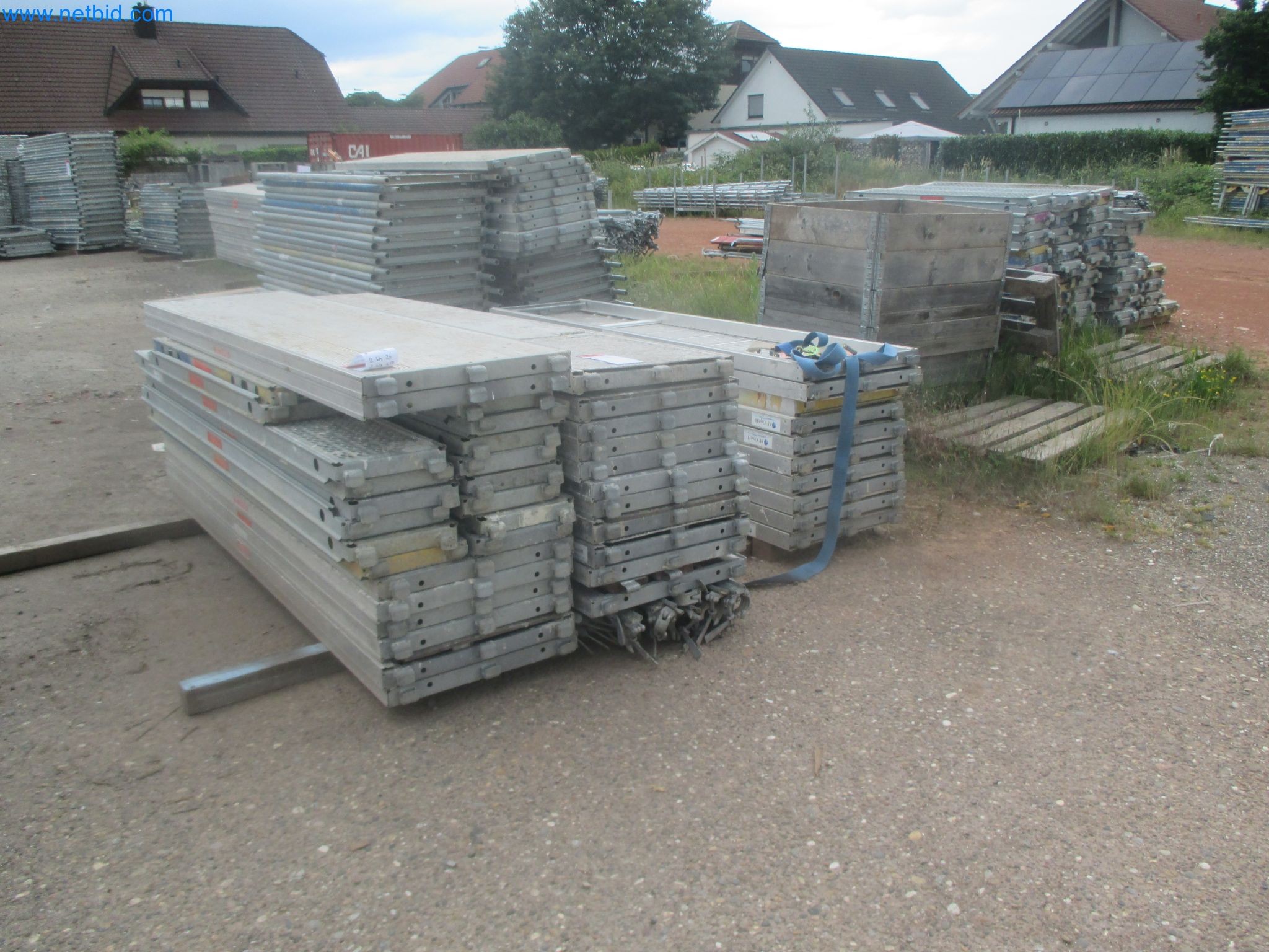 Scaffolding components (some from the construction site), machinery, and vehicles belonging to a construction company-7