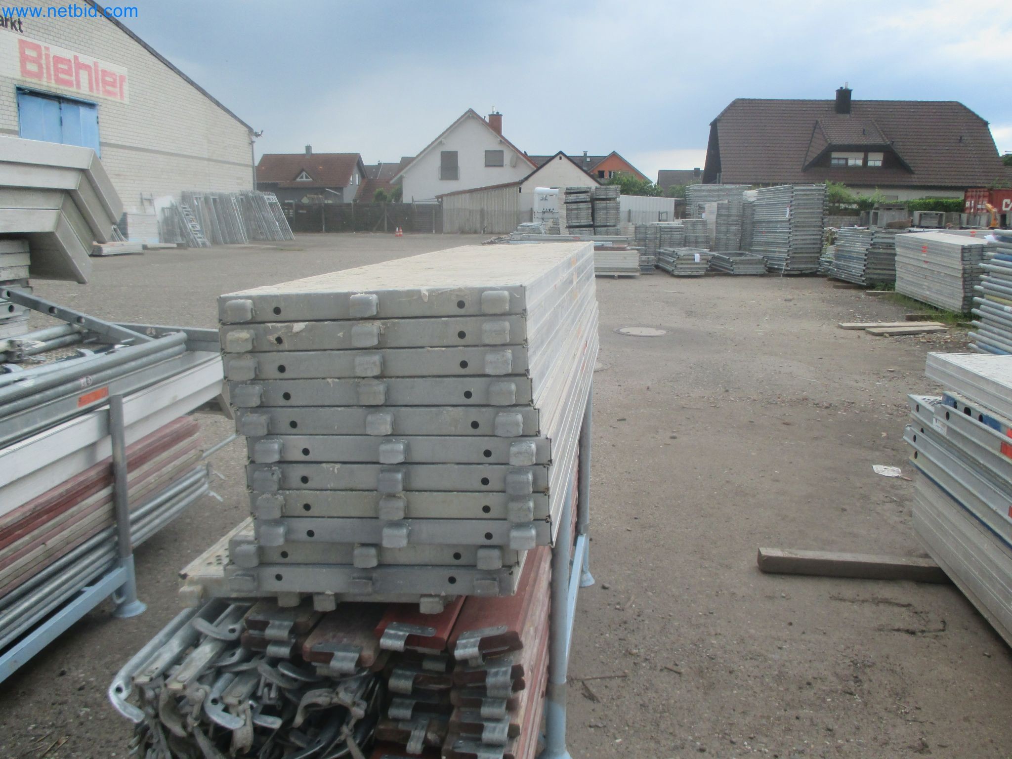 Scaffolding components (some from the construction site), machinery, and vehicles belonging to a construction company-8