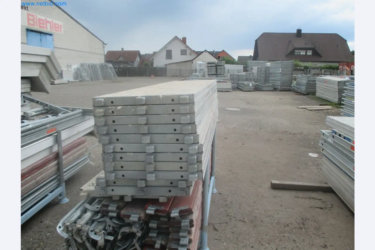 Scaffolding components (some from the construction site), machinery, and vehicles belonging to a construction company-8