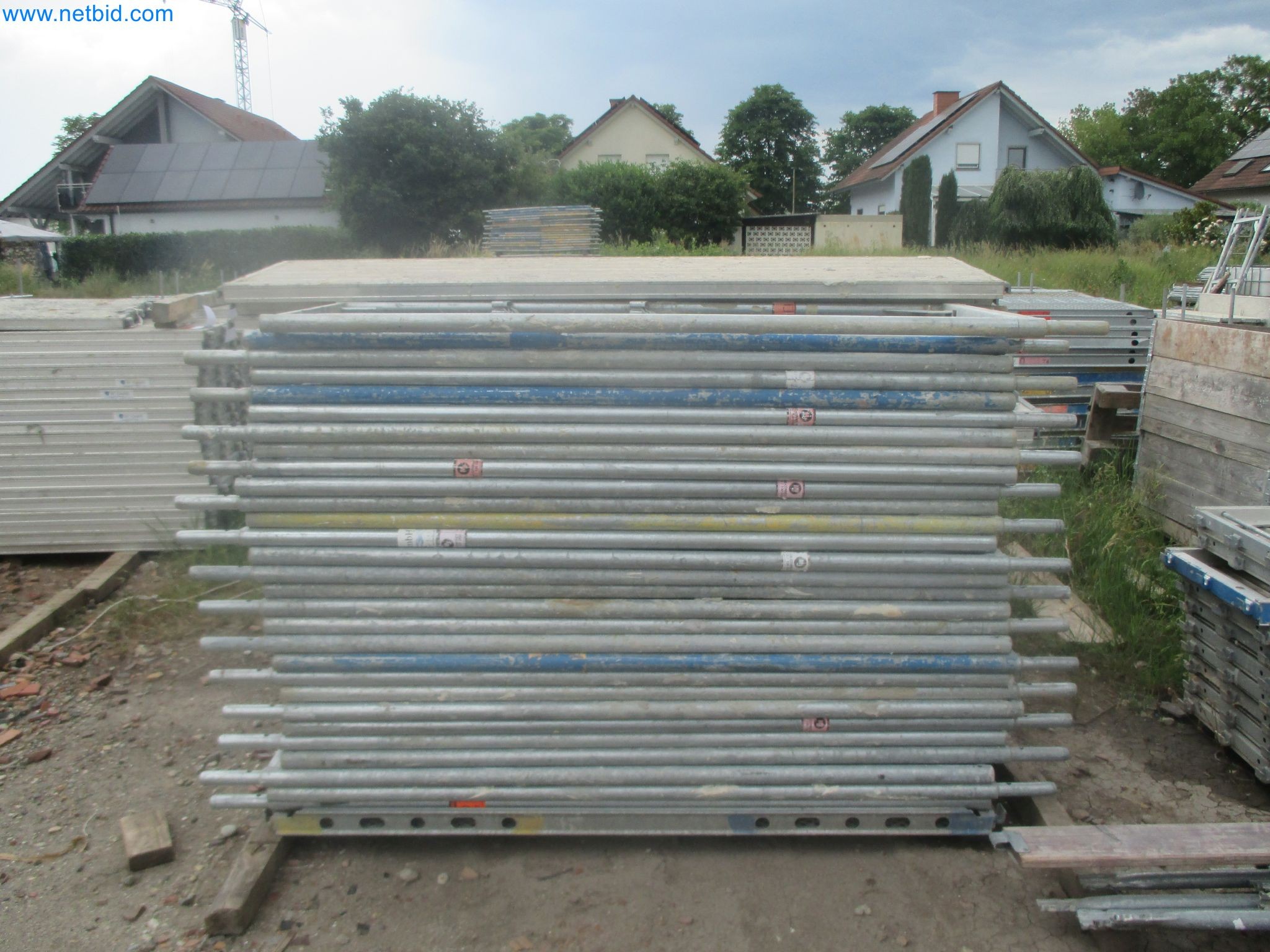 Scaffolding components (some from the construction site), machinery, and vehicles belonging to a construction company-9