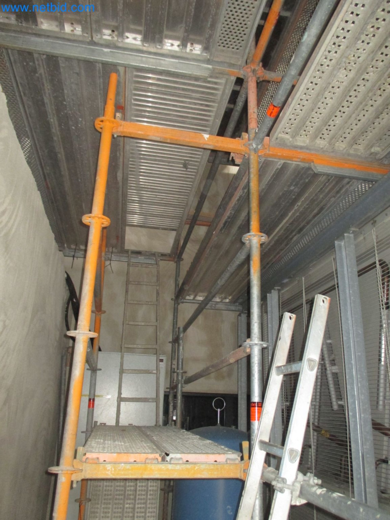 Scaffolding components (some from the construction site), machinery, and vehicles belonging to a construction company-12