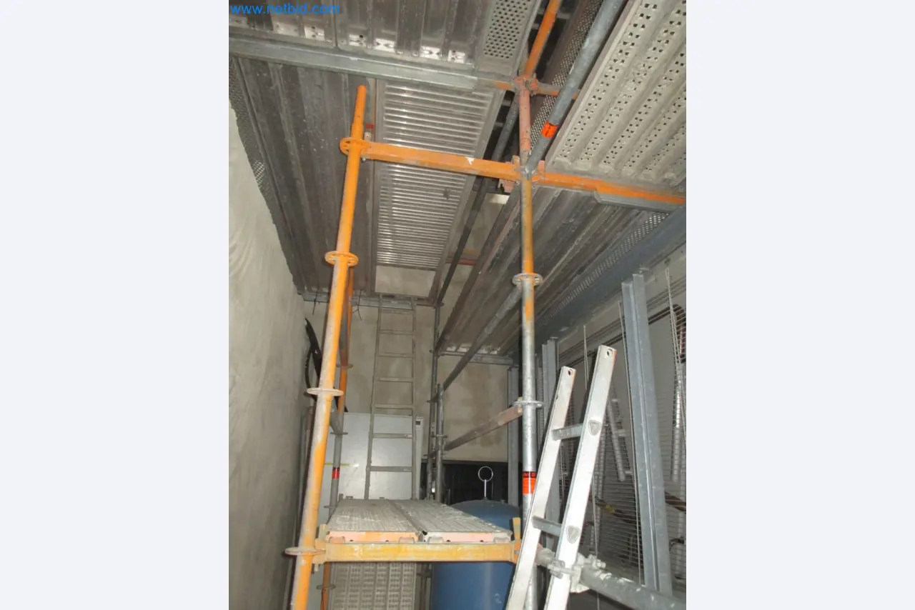 Scaffolding components (some from the construction site), machinery, and vehicles belonging to a construction company-12