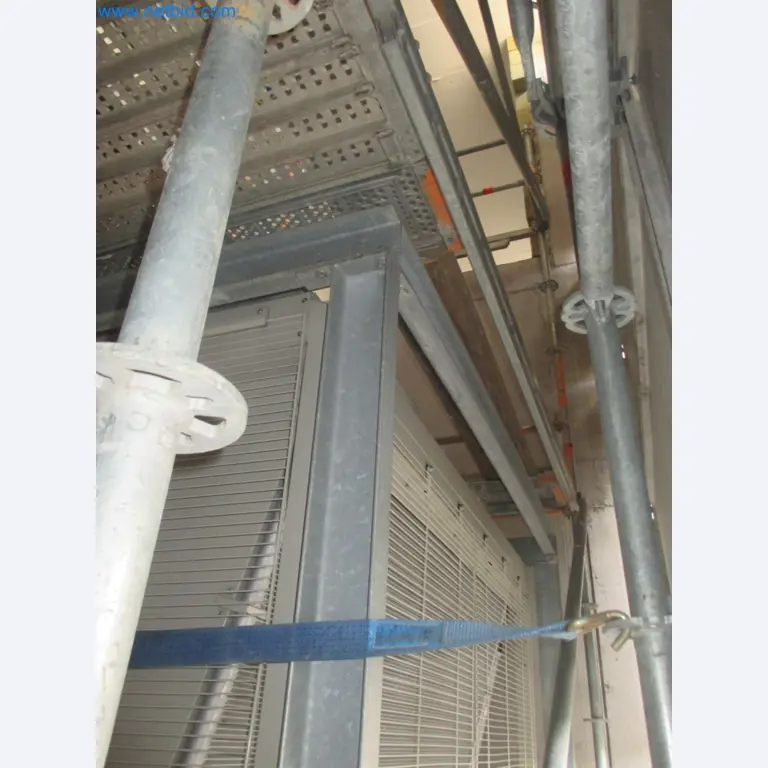 Scaffolding components (some from the construction site), machinery, and vehicles belonging to a construction company-13