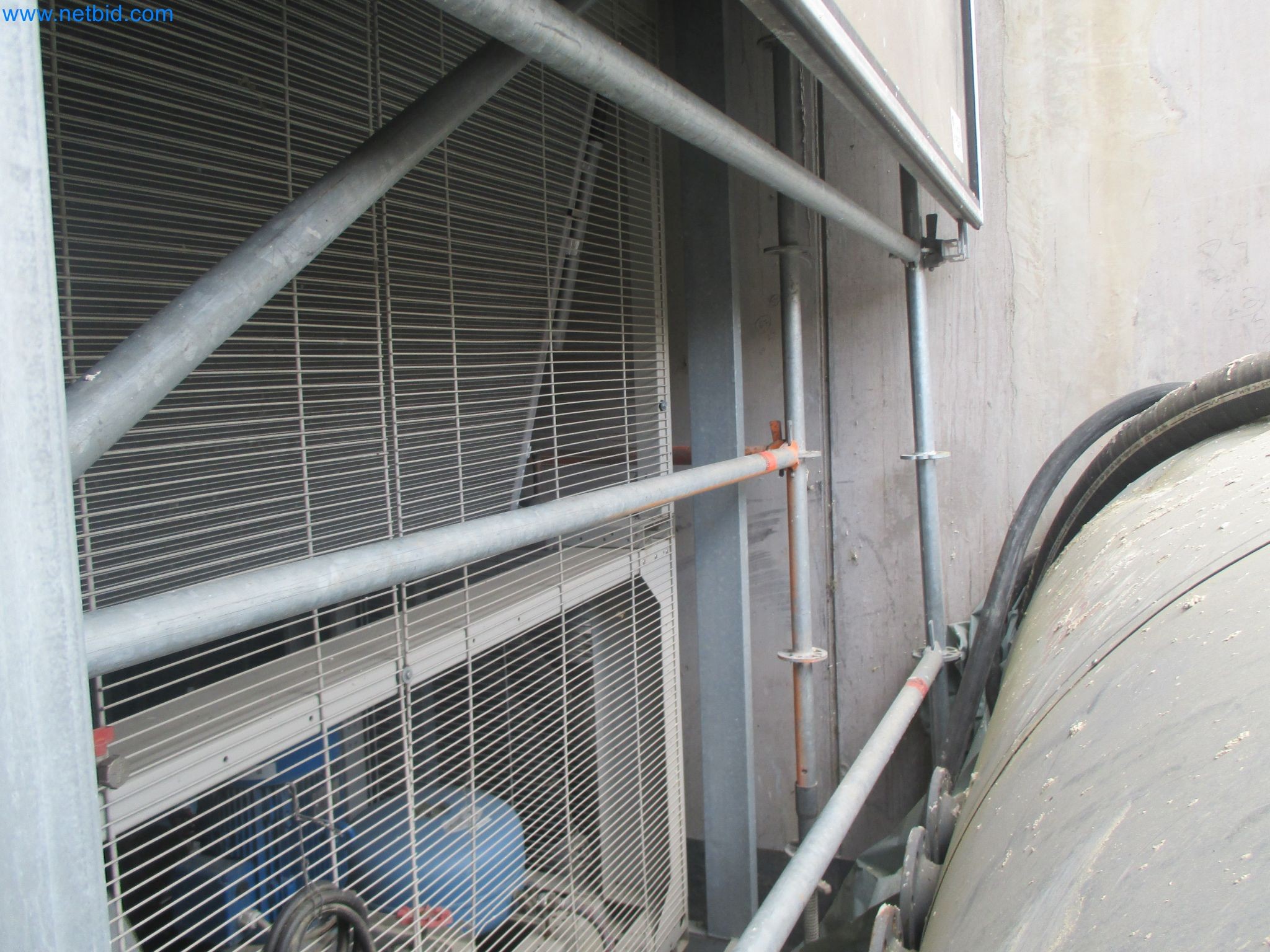 Scaffolding components (some from the construction site), machinery, and vehicles belonging to a construction company-14