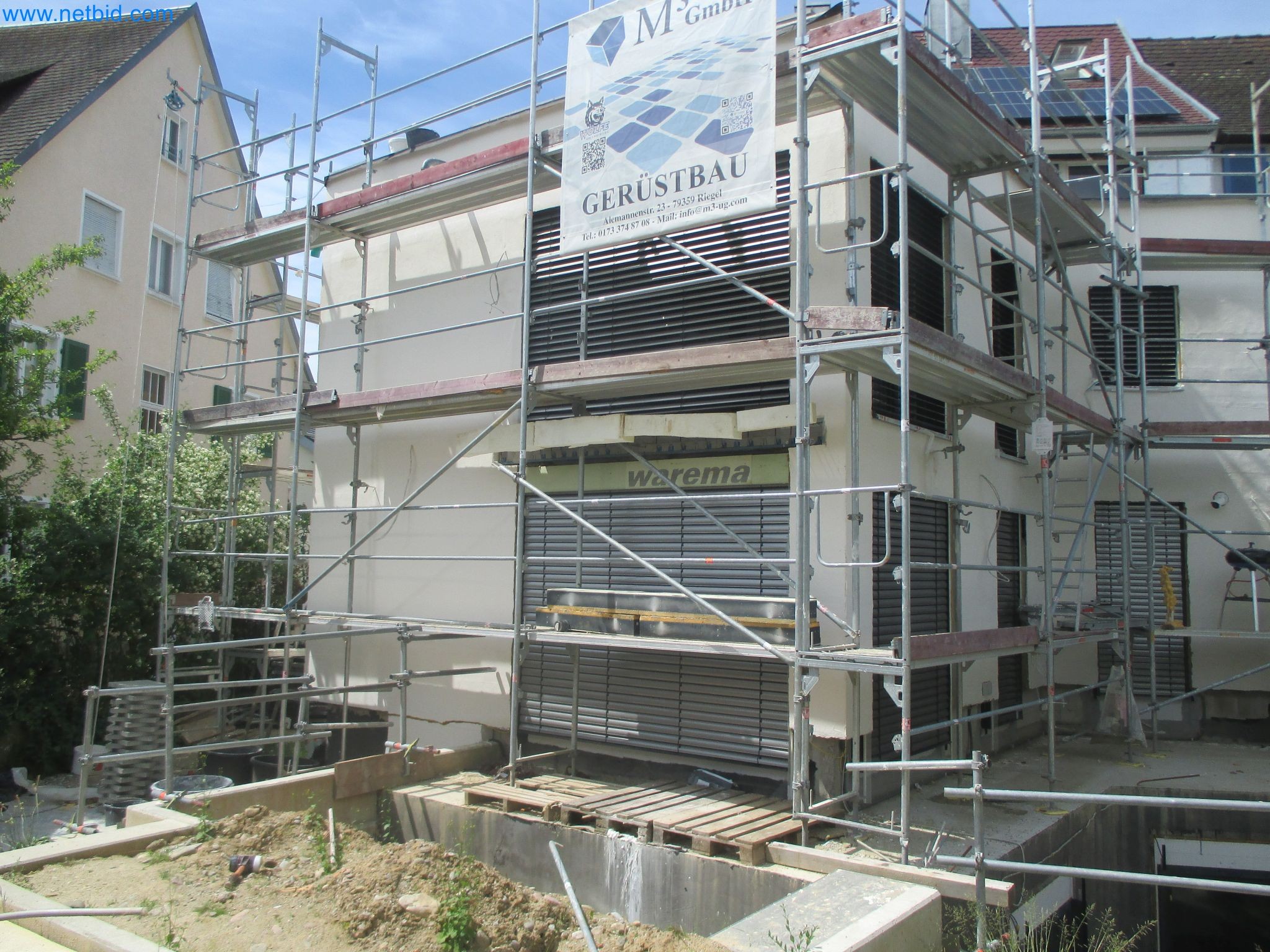 Scaffolding components (some from the construction site), machinery, and vehicles belonging to a construction company-1