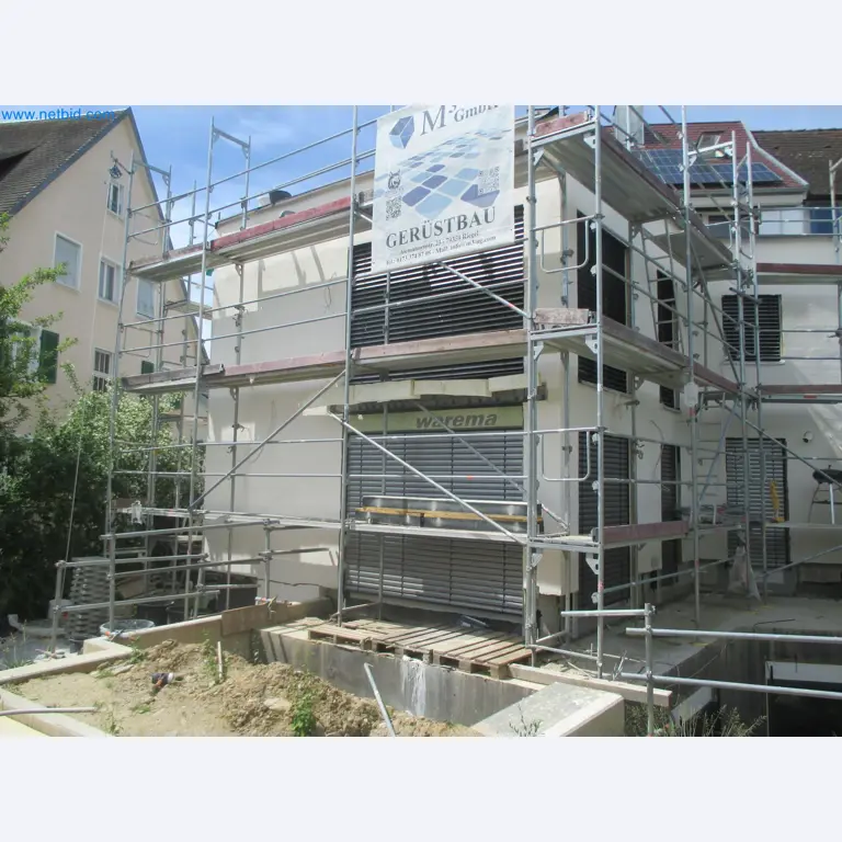 Scaffolding components (some from the construction site), machinery, and vehicles belonging to a construction company-1