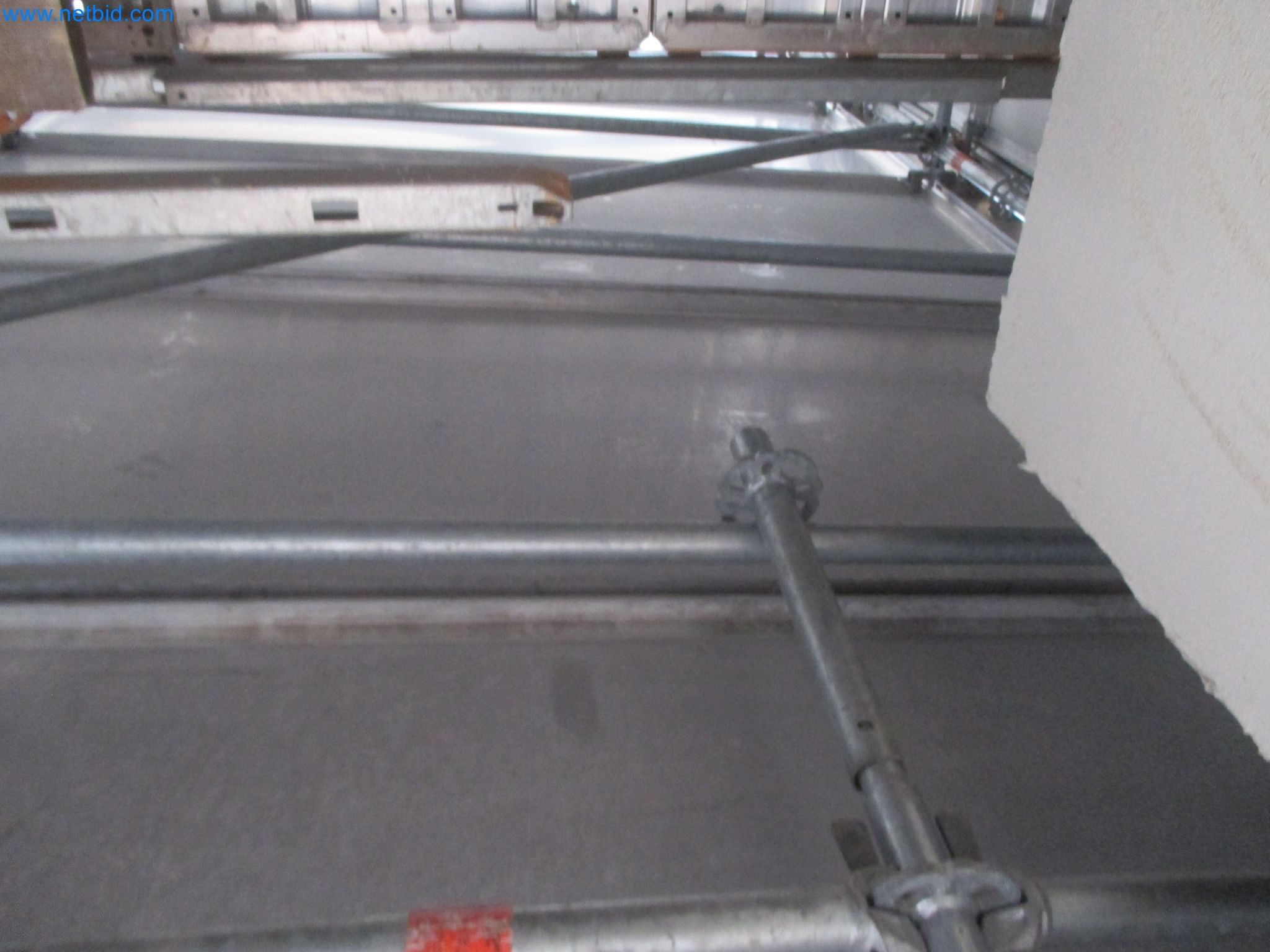 Scaffolding components (some from the construction site), machinery, and vehicles belonging to a construction company-5