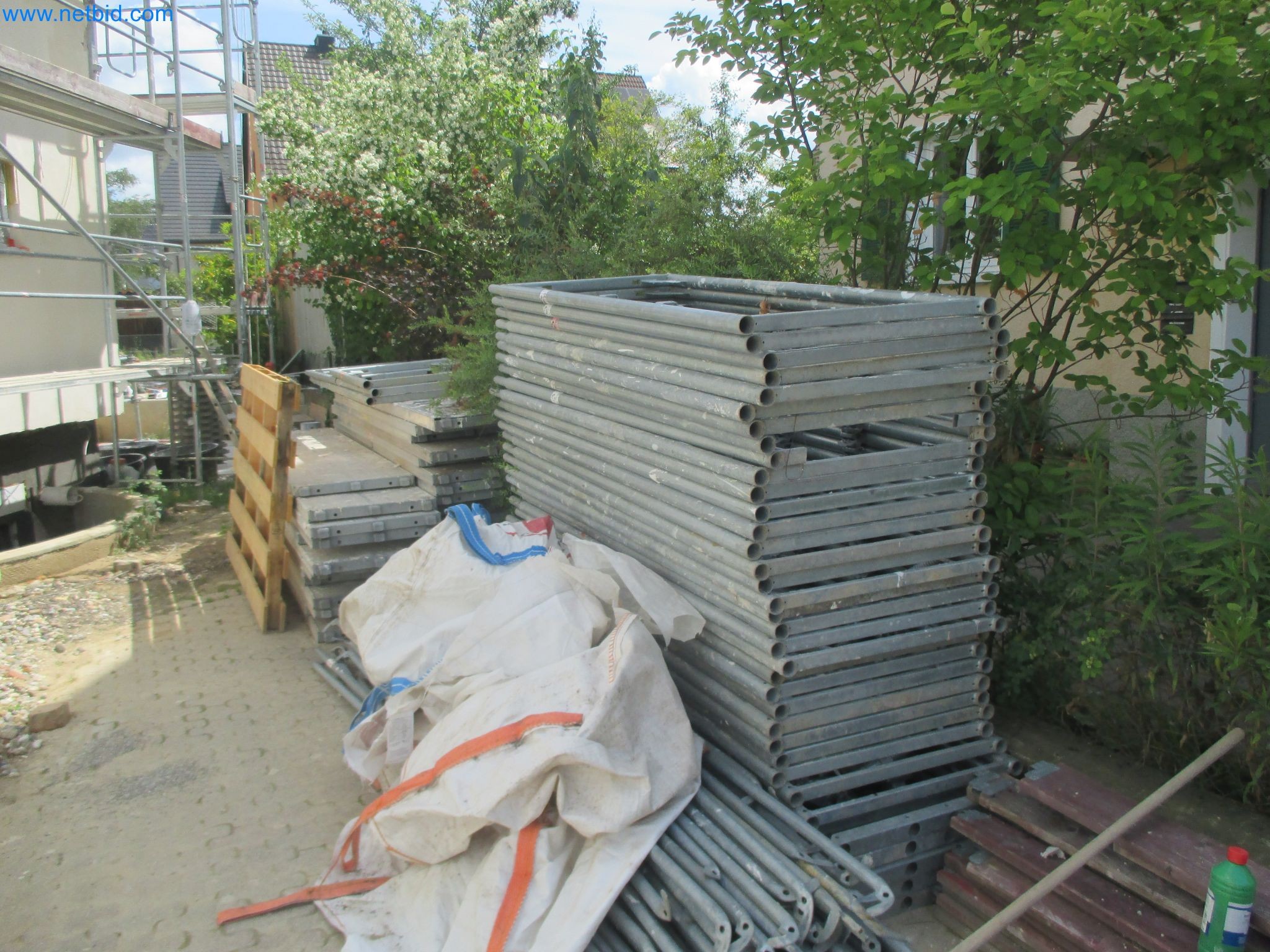 Scaffolding components (some from the construction site), machinery, and vehicles belonging to a construction company-8
