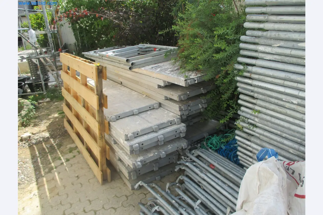 Scaffolding components (some from the construction site), machinery, and vehicles belonging to a construction company-9