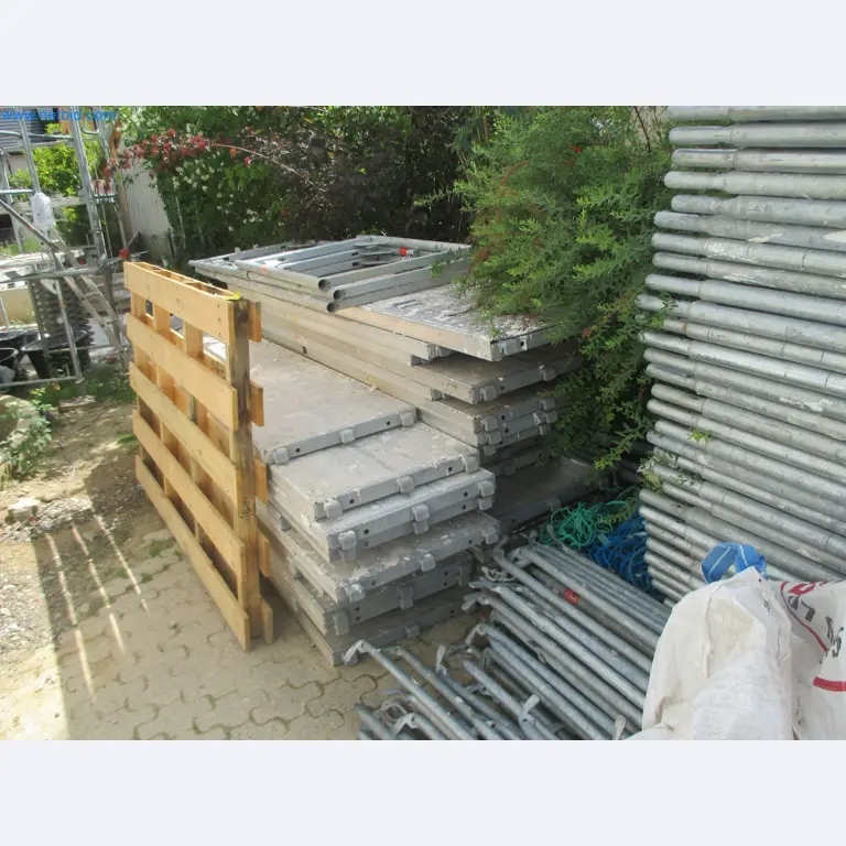 Scaffolding components (some from the construction site), machinery, and vehicles belonging to a construction company-9