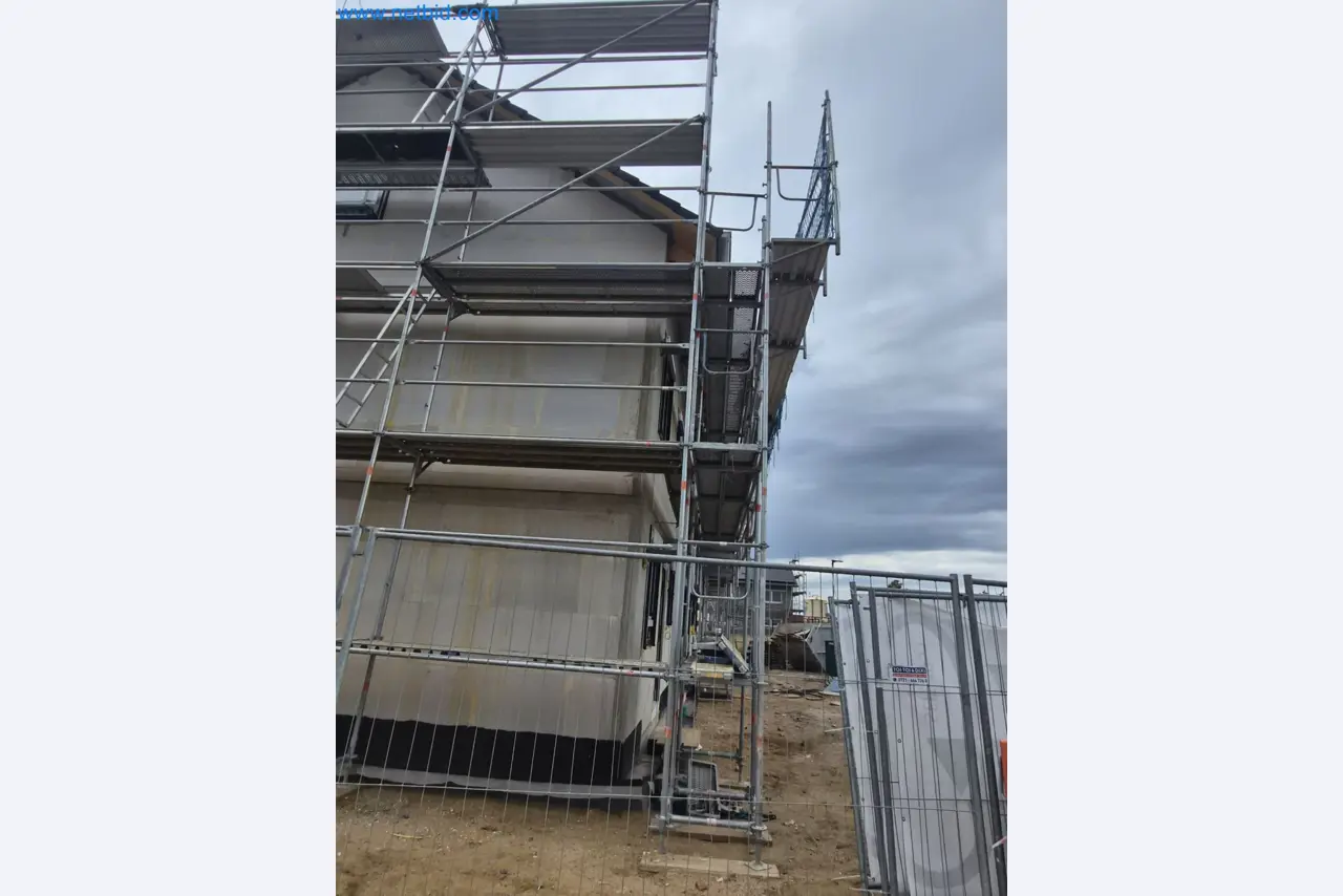 Scaffolding components (some from the construction site), machinery, and vehicles belonging to a construction company-4