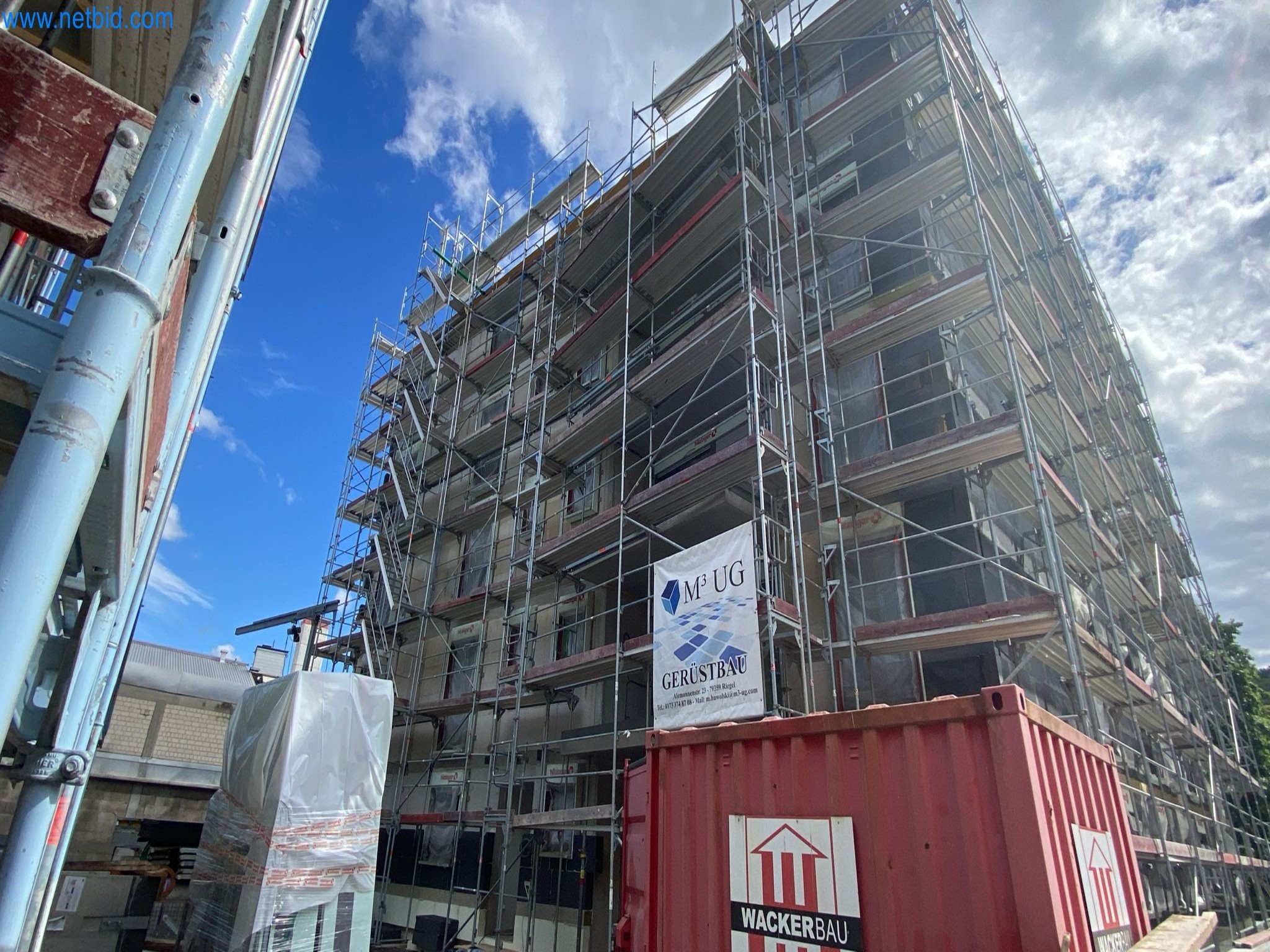 Scaffolding components (some from the construction site), machinery, and vehicles belonging to a construction company-2