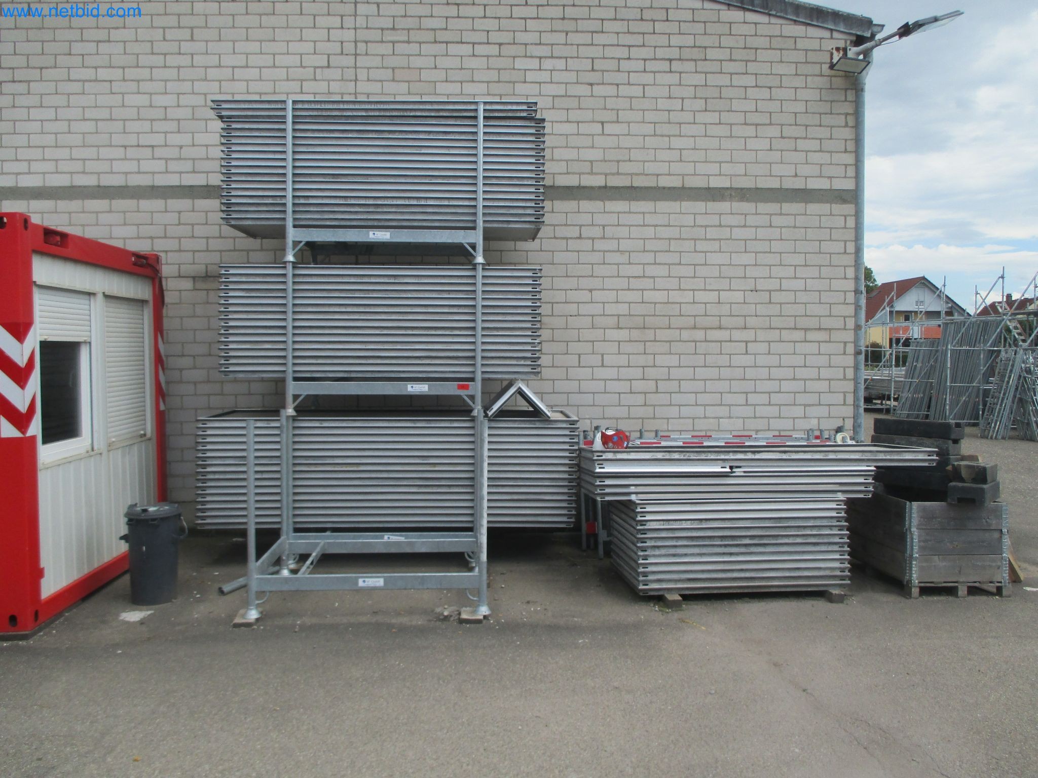 Scaffolding components (some from the construction site), machinery, and vehicles belonging to a construction company-1