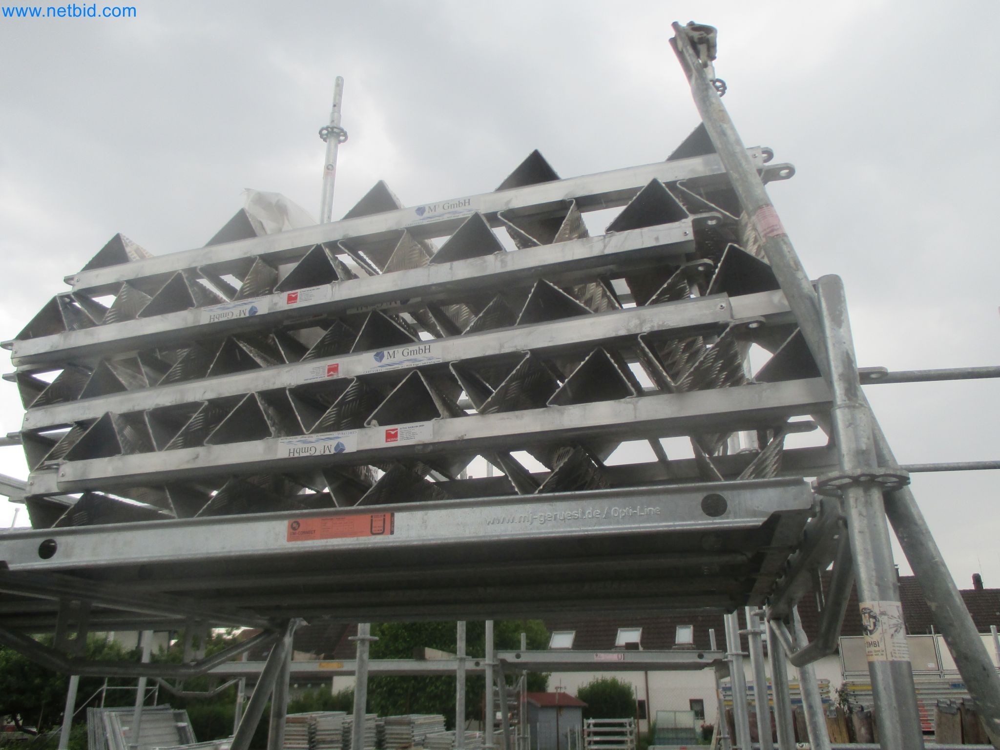 Scaffolding components (some from the construction site), machinery, and vehicles belonging to a construction company-1