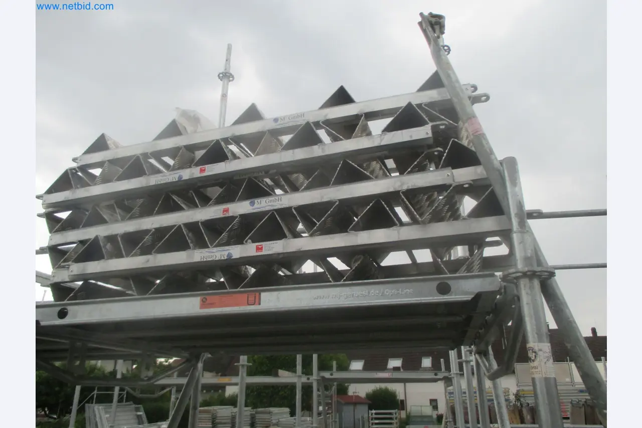 Scaffolding components (some from the construction site), machinery, and vehicles belonging to a construction company-1