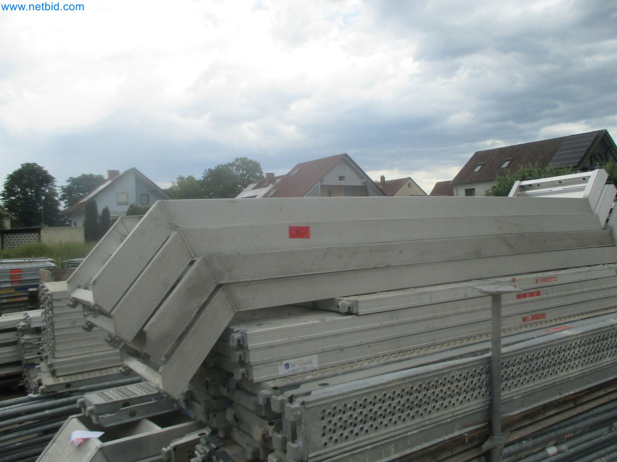 Scaffolding components (some from the construction site), machinery, and vehicles belonging to a construction company-2