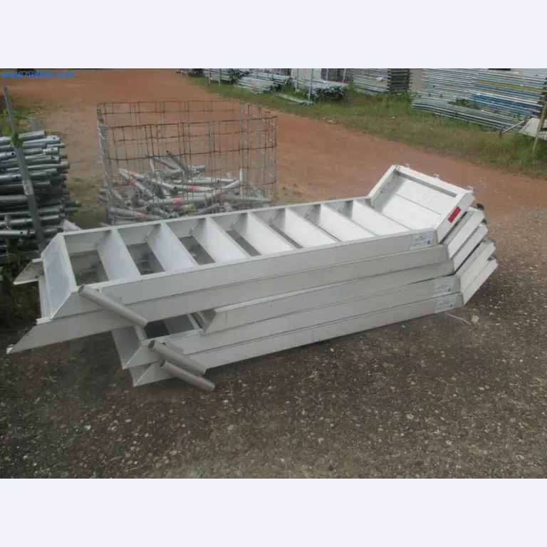 Scaffolding components (some from the construction site), machinery, and vehicles belonging to a construction company-4