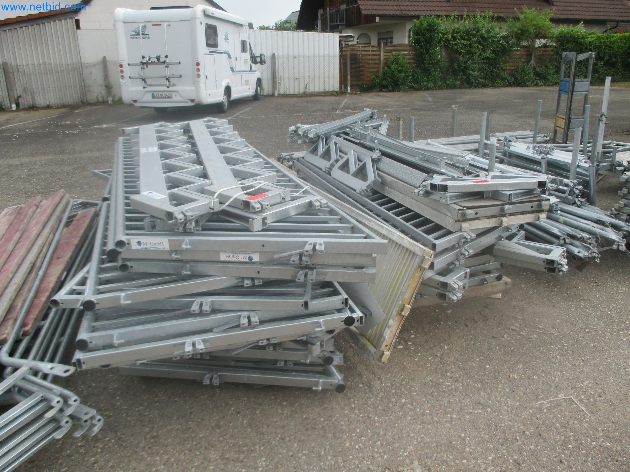 Scaffolding components (some from the construction site), machinery, and vehicles belonging to a construction company-1