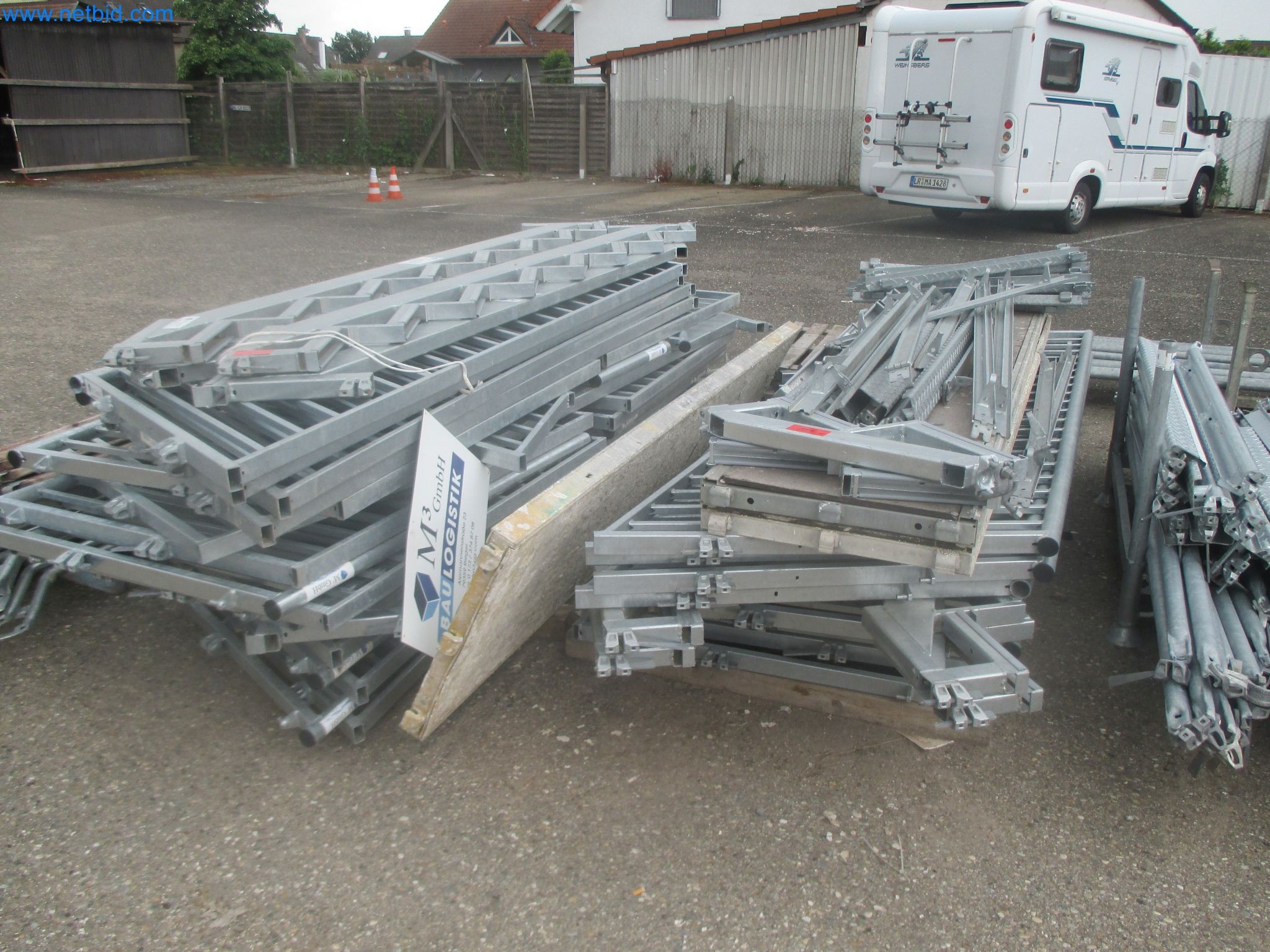 Scaffolding components (some from the construction site), machinery, and vehicles belonging to a construction company-2