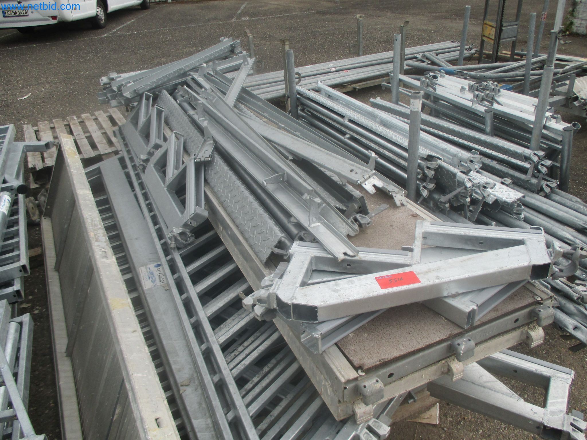 Scaffolding components (some from the construction site), machinery, and vehicles belonging to a construction company-4