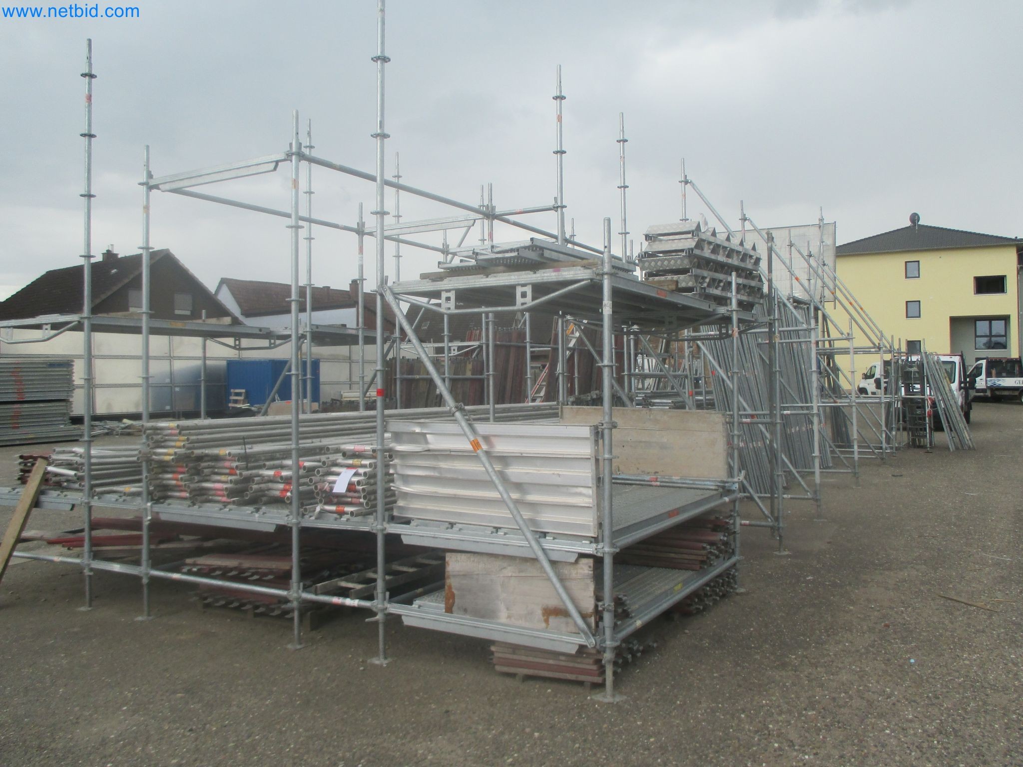 Scaffolding components (some from the construction site), machinery, and vehicles belonging to a construction company-1
