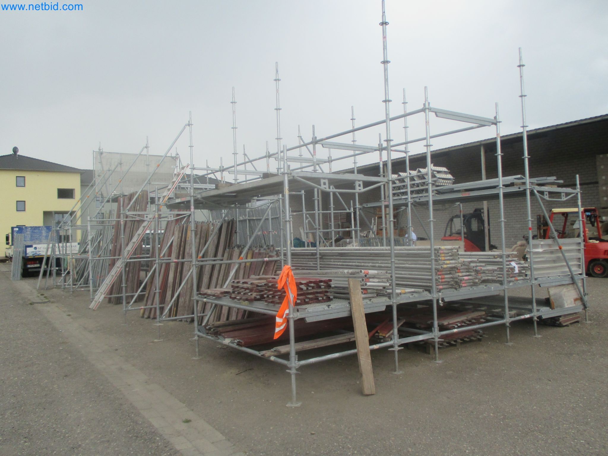 Scaffolding components (some from the construction site), machinery, and vehicles belonging to a construction company-2