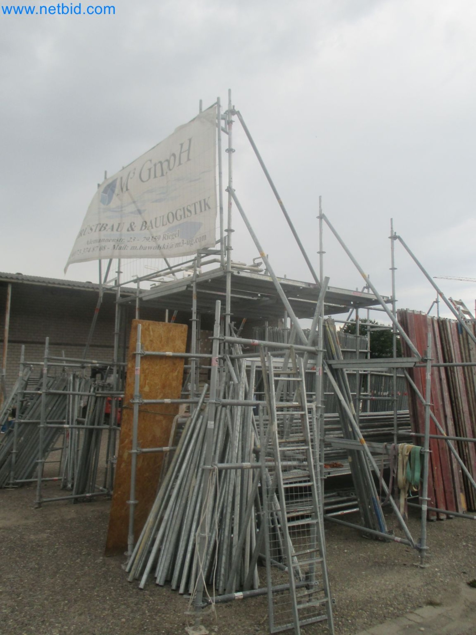 Scaffolding components (some from the construction site), machinery, and vehicles belonging to a construction company-4