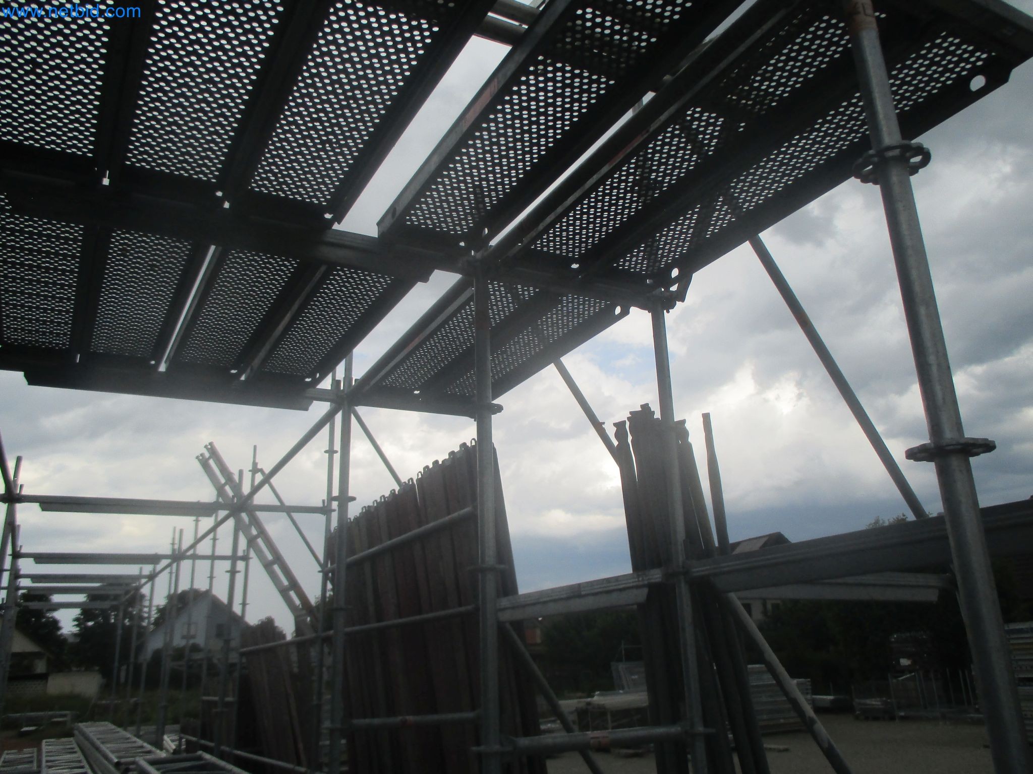 Scaffolding components (some from the construction site), machinery, and vehicles belonging to a construction company-5