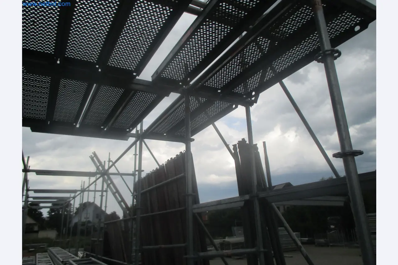 Scaffolding components (some from the construction site), machinery, and vehicles belonging to a construction company-5