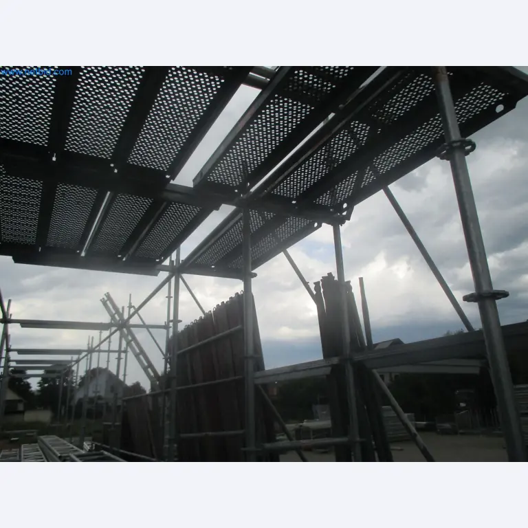 Scaffolding components (some from the construction site), machinery, and vehicles belonging to a construction company-5