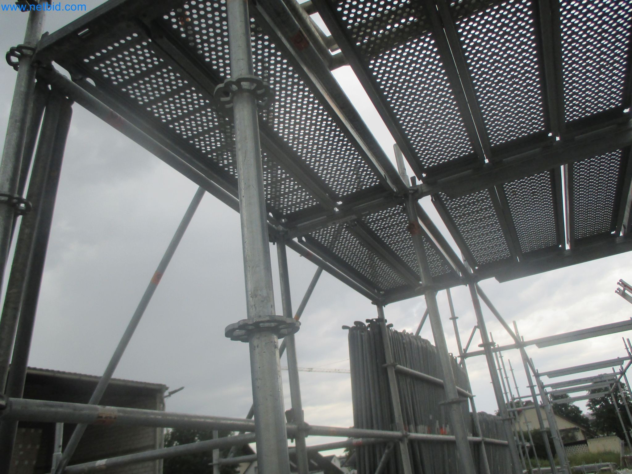 Scaffolding components (some from the construction site), machinery, and vehicles belonging to a construction company-6
